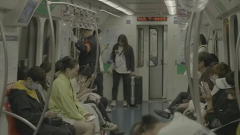 Passengers Seated Inside a Beijing Subway Train Car Vidéo 341457205
