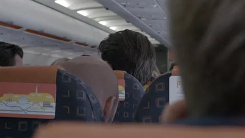 Passengers Seated Inside Commercial Airplane Cabin Stock Footage 343978054