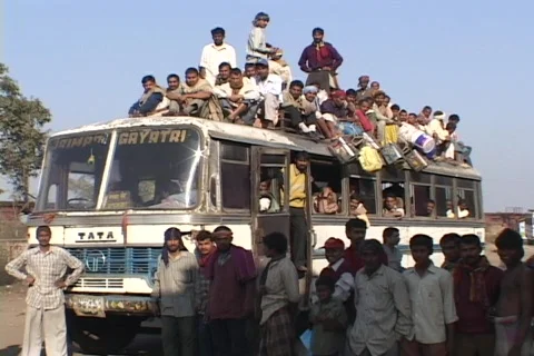 Passengers sit atop a crowded bus. Stock Footage
