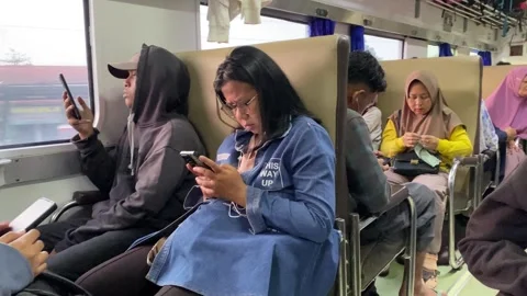 Passengers sit in an economy train Stock Footage 290259233
