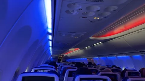 Passengers sits inside airplane Vídeos de archivo 327697086