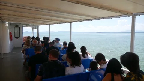 Passengers Sitting on a Deck of a Riverboat Sailing on a Large Lake Stock Footage 244815790