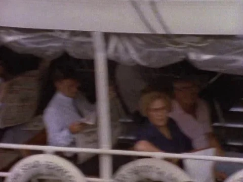 Passengers sitting in the ferry as it passes by Video stock 79878054