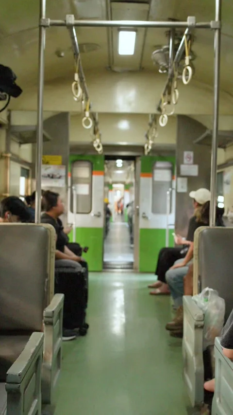 Passengers Sitting Inside Moving Bangkok Commuter Train Carriage 動画素材 323341347
