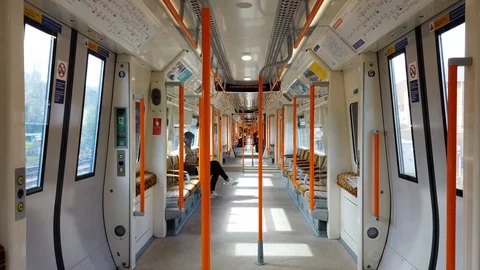 Passengers sitting inside a moving Overground train in London, UK Video stock 107085919