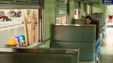 Passengers Sitting Inside Old Bangkok Commuter Train Carriage 動画素材 323683207