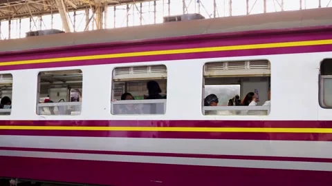 Passengers Sitting Inside Stationary Commuter Train in Bangkok Station 動画素材 323683118