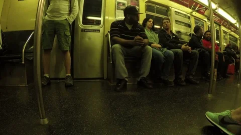 Passengers sitting inside subway train on Manhattan in NYC 库存影片 77316826