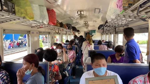 Passengers sitting on local train at Bang Sue Railway Station sunny day Video stock 221898488