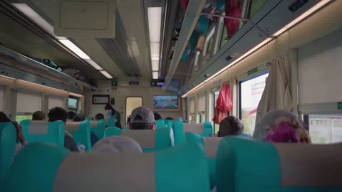 Passengers sitting in the train seats. Relaxing and enjoying the journey. Stock-Footage 248779463