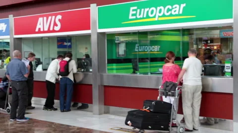 Passengers stand in queue for vehicles hire. Airport of Tenerife island Stock Footage 62384493