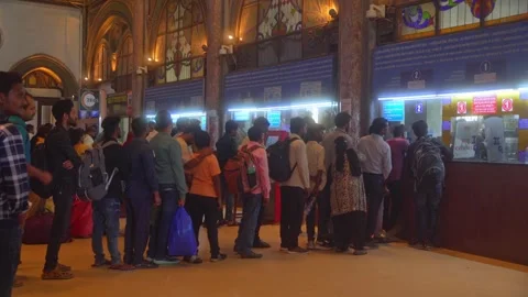 Passengers standing in queue at Chhatrapati Shivaji Maharaj Terminus railway Video stock 309941679