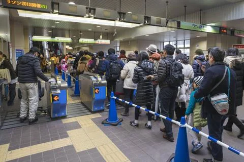 Passengers standing in queue get railway platform, tokyo, japan Copyright:... Stock Photos