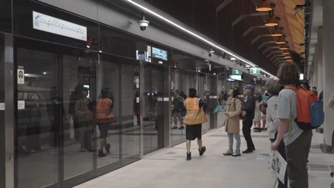 Passengers on State Library Station Platform Opening Day Stock Footage 322076009