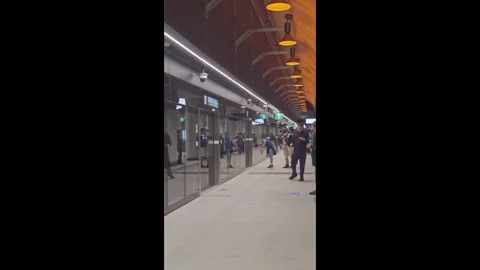 Passengers on State Library Station Platform Opening Day Stock Footage 322222428