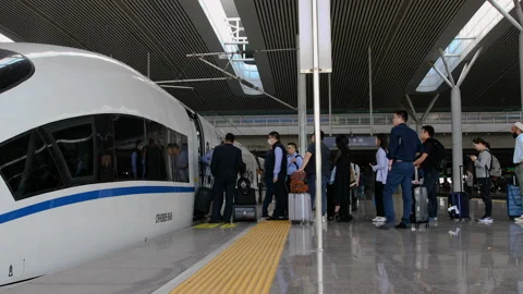 Passengers stepping down from High-speed CRH bullet train Stock Footage 140480291