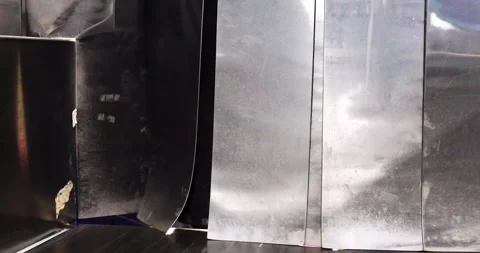Passengers' suitcases are placed on the baggage carousel after arrival by pl Stock Footage 345275021