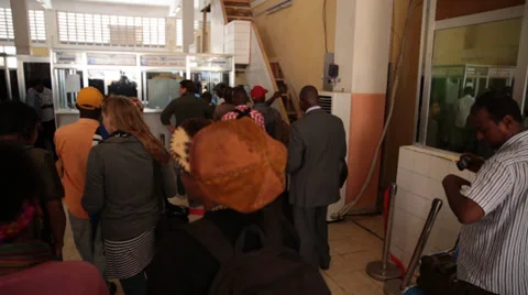 Passengers talk while waiting to pass security gate at airport in Mogadishu, Stock Footage 35439492
