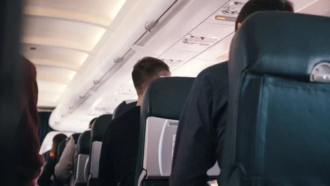 Passengers talking on board of an airplane Stock Footage 112143031