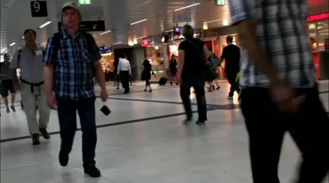 Passengers with things go through an underpass of train station in Dusseldorf Stock Footage 40732028