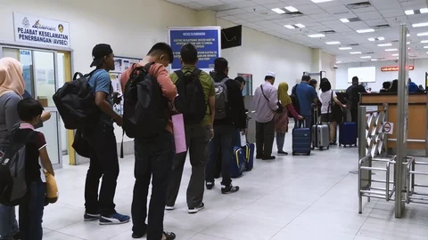 Passengers thru immigration checking before boarding Stock Footage 108628079