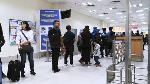 Passengers thru immigration checking before boarding Stock Footage 108628133