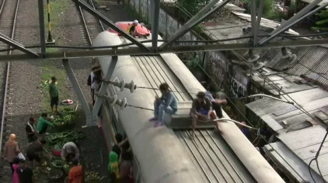 Passengers on Top Commuter Train Stock-Footage 693030