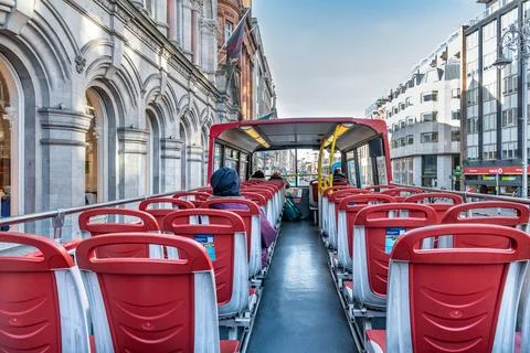 Passengers on the top deck of an open top tourist bus, Dublin, Ireland Stock Photos