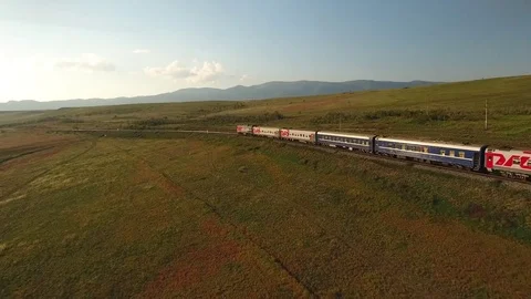 Passengers train fast speed ride railway Russia Mongolia nature Rails Aerial 4k Stock Footage 74961422