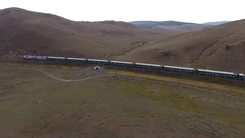 Passengers train follow drift to China North Mongolia nature Aerial drone 4k     Stock Footage 74795683