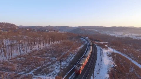 Passengers train winter fast speed. Snow cold aerial 4k in front of locomotive Stock Footage 74503262