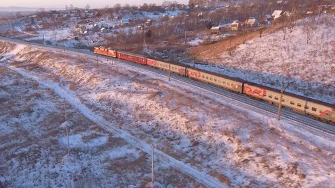 Passengers train winter fast speed. Snow aerial drone 4k Cold frozen north Stock Footage 74503279