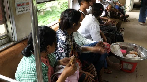 Passengers on a train in Yangon periphery, Burma, Asia in 4K Stock Footage 94711657