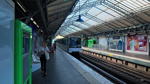 Passengers traveling by Metro using train station in Paris. Stock Footage 245456227