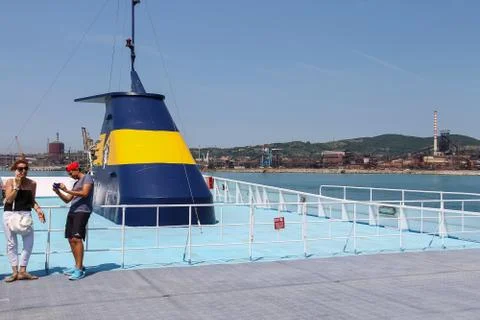 Passengers on the upper deck of sailing ferry boat, Piombino, Italy Stock Photos