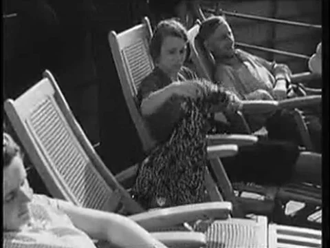 Passengers on the upper deck of the Wilhelm Gustloff cruise ship enjoy food, Stock Footage 74998832