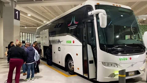 Passengers use a shuttle bus in AIFA airport, Mexico City 4K Stock Footage 305600332