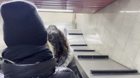 Passengers using the escalator in the Milan Metro, Italy. Vídeos de archivo 263027662