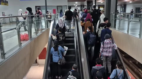 Passengers using escalators Stock Footage 341757642