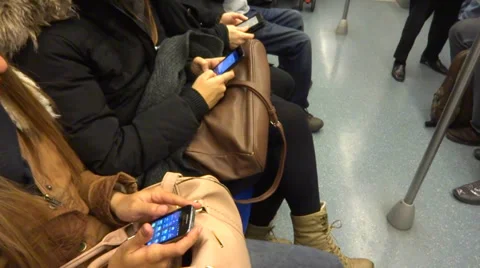 Passengers using phone in metro subway Vidéo 35658299