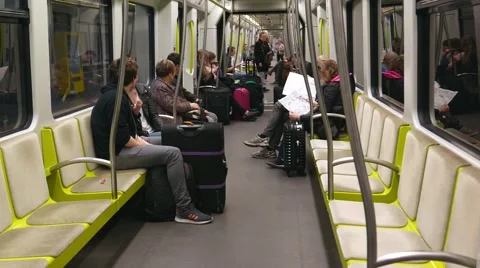 Passengers on a Valencia Metro train riding to the Valencia Airport Stock Footage 62539934