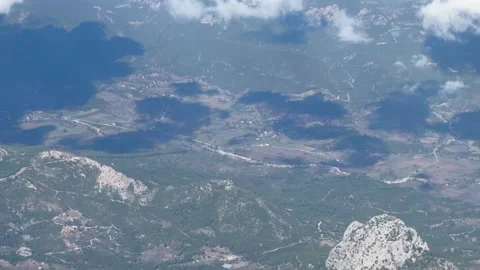 A passengers view from a plane flying above breathtaking mountainsfirst focus 스톡 동영상 325649537