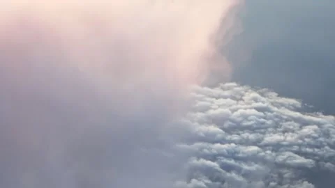 A passenger's view: The plane is flying into a patch of clouds. Vídeos de archivo 317272484