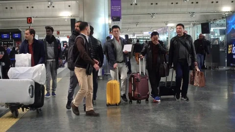 Passengers wait at the check in queue in departure terminal of airport. Video stock 87914441