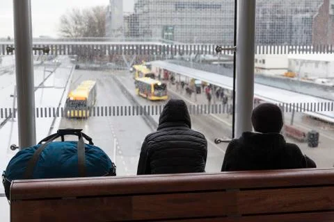 Passengers wait inside station for bus on rainy day in dutch city of utrecht Foto stock