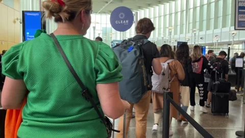 Passengers wait in long line TSA Screening Line, Security Checkpoint at Airport Stock Footage 256245478