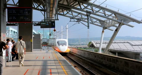 Passengers wait on the platform for the high-speed rail train to arrive. 動画素材 331050571