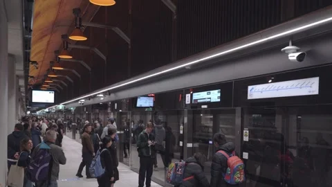 Passengers Wait on State Library Station Platform Stock Footage 322076027