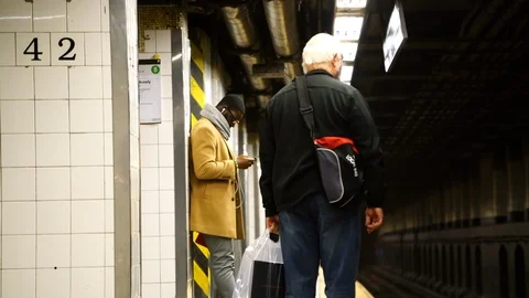 Passengers Wait for Subway train on 42nd Street Platform  - Manhattan Stock Footage 108746674