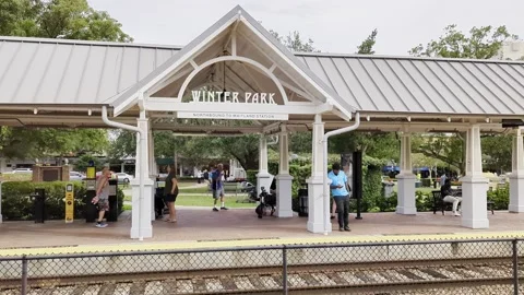 Passengers wait for SunRail in Winter Park Video stock 221395344